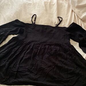 Black top with elastic bodice and sleeve tops, blousy bottom